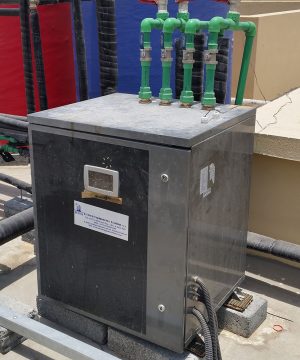 Retrofit of centralized water heating system with solar and heat pump combined